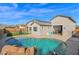 Stunning pool and backyard view, complete with a waterfall feature at 19027 W Sierra St, Surprise, AZ 85388