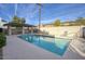 Community pool with lounge chairs and covered seating area at 2142 E Turney Ave # 9, Phoenix, AZ 85016