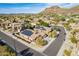 Aerial view showcasing a home with solar panels and a community backdrop at 27204 N 86Th Dr, Peoria, AZ 85383