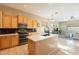 Open kitchen featuring island, modern appliances, and ample cabinetry at 27204 N 86Th Dr, Peoria, AZ 85383