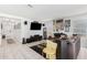 Living room with gray sectional sofa and eclectic wall art at 2955 E Farmdale Ave, Mesa, AZ 85204