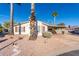 Single story home with carport and desert landscaping at 3301 S Goldfield Rd # 1004, Apache Junction, AZ 85119