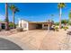 Single story home with carport and desert landscaping at 3301 S Goldfield Rd # 1004, Apache Junction, AZ 85119