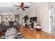 Living room with hardwood floors and ceiling fan at 3301 S Goldfield Rd # 1004, Apache Junction, AZ 85119