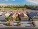 Single-story house with tile roof and a two-car garage, in a golf course community at 3533 N 159Th Ln, Goodyear, AZ 85395