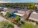 House with solar panels, a large patio, and a circular fountain at 3533 N 159Th Ln, Goodyear, AZ 85395