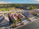 Single-story house with tile roof and a two-car garage, in a golf course community at 3533 N 159Th Ln, Goodyear, AZ 85395