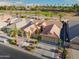 Single-story house with tile roof and a two-car garage, in a golf course community at 3533 N 159Th Ln, Goodyear, AZ 85395