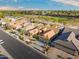 Aerial view of single story home with tile roof and desert landscaping, near golf course at 3533 N 159Th Ln, Goodyear, AZ 85395