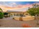 Patio with solar panel equipped home, seating area, and fire pit at 3533 N 159Th Ln, Goodyear, AZ 85395