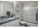 Clean bathroom with granite countertop, white cabinets, and a shower/tub combo at 3533 N 159Th Ln, Goodyear, AZ 85395