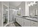 Modern bathroom with granite vanity and glass shower at 3533 N 159Th Ln, Goodyear, AZ 85395