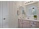 Bathroom with light wood vanity and a large mirror at 3533 N 159Th Ln, Goodyear, AZ 85395