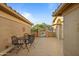 Private courtyard featuring a table and chairs, perfect for outdoor dining at 3533 N 159Th Ln, Goodyear, AZ 85395