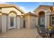 Inviting courtyard with patio furniture and a welcoming entrance at 3533 N 159Th Ln, Goodyear, AZ 85395