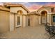Inviting front entry with tiled courtyard and seating area at 3533 N 159Th Ln, Goodyear, AZ 85395
