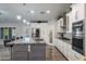 Spacious kitchen with large island and stainless steel appliances at 3533 N 159Th Ln, Goodyear, AZ 85395