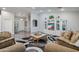 Open living room with plush seating and wood flooring at 3533 N 159Th Ln, Goodyear, AZ 85395