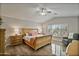 Large main bedroom with wood furniture and ceiling fan at 3533 N 159Th Ln, Goodyear, AZ 85395