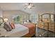 Main bedroom with plush bedding and access to patio at 3533 N 159Th Ln, Goodyear, AZ 85395