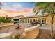 Backyard patio with fountain, seating area, and view of the golf course at 3533 N 159Th Ln, Goodyear, AZ 85395