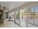 Sunroom with access to the backyard and a view of the golf course at 3533 N 159Th Ln, Goodyear, AZ 85395