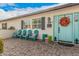 Inviting front porch with teal chairs and decorative pots at 4307 E Avalon Dr, Phoenix, AZ 85018