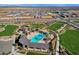 Aerial view showing community pool and surrounding landscape at 4342 E Enmark Dr, San Tan Valley, AZ 85143