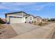 Single-story home with a two-car garage and well-manicured landscaping at 4342 E Enmark Dr, San Tan Valley, AZ 85143