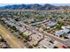 Aerial view of homes situated in a neighborhood near mountains at 4402 E Cheyenne Dr, Phoenix, AZ 85044