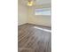 Bright bedroom with wood-look flooring and ceiling fan at 4447 W Carol Ave, Glendale, AZ 85302