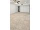 Bright living room featuring tile floors and a ceiling fan at 4447 W Carol Ave, Glendale, AZ 85302