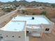 Aerial view showcasing the roof of a new home with a flat roof design at 48111 N 7Th Ave, New River, AZ 85087