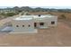 Aerial view of a tan stucco home with mountain views at 48111 N 7Th Ave, New River, AZ 85087