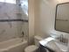 Bathroom with marble tile, bathtub, and vanity with granite countertop at 48111 N 7Th Ave, New River, AZ 85087