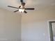 Bedroom featuring a ceiling fan, neutral walls, and a door to another room at 48111 N 7Th Ave, New River, AZ 85087