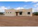 Tan stucco home with a wooden door and desert landscaping at 48111 N 7Th Ave, New River, AZ 85087