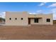 Tan stucco home with a wooden door and desert landscaping at 48111 N 7Th Ave, New River, AZ 85087