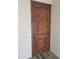 Solid wood front door with dark brown finish at 48111 N 7Th Ave, New River, AZ 85087