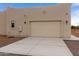 New construction home with attached garage and concrete driveway at 48111 N 7Th Ave, New River, AZ 85087