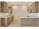 Modern kitchen with dark brown cabinetry and granite countertops at 48111 N 7Th Ave, New River, AZ 85087