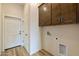 Laundry room with upper cabinets and built-in space for washer and dryer at 48111 N 7Th Ave, New River, AZ 85087