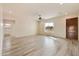 Bright and airy living room with tile floors and a wood door at 48111 N 7Th Ave, New River, AZ 85087