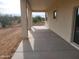 Covered patio with concrete flooring and views of the desert landscape at 48111 N 7Th Ave, New River, AZ 85087