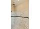 Walk-in shower with marble tile and built-in bench at 48111 N 7Th Ave, New River, AZ 85087