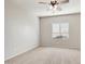 Simple bedroom with carpeted floor and window at 5451 W Victory Way, Florence, AZ 85132