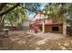 View of the home's backyard, showing a deck and trees at 5525 W Harrison Ct, Chandler, AZ 85226