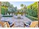 Serene patio with seating area, fountain, and lush landscaping at 6240 N 59Th Pl, Paradise Valley, AZ 85253