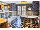 Luxurious bathroom with a freestanding tub and stylish wallpaper at 6240 N 59Th Pl, Paradise Valley, AZ 85253