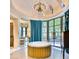 Stunning bathroom with a free-standing tub, large windows, and an ornate chandelier at 6240 N 59Th Pl, Paradise Valley, AZ 85253